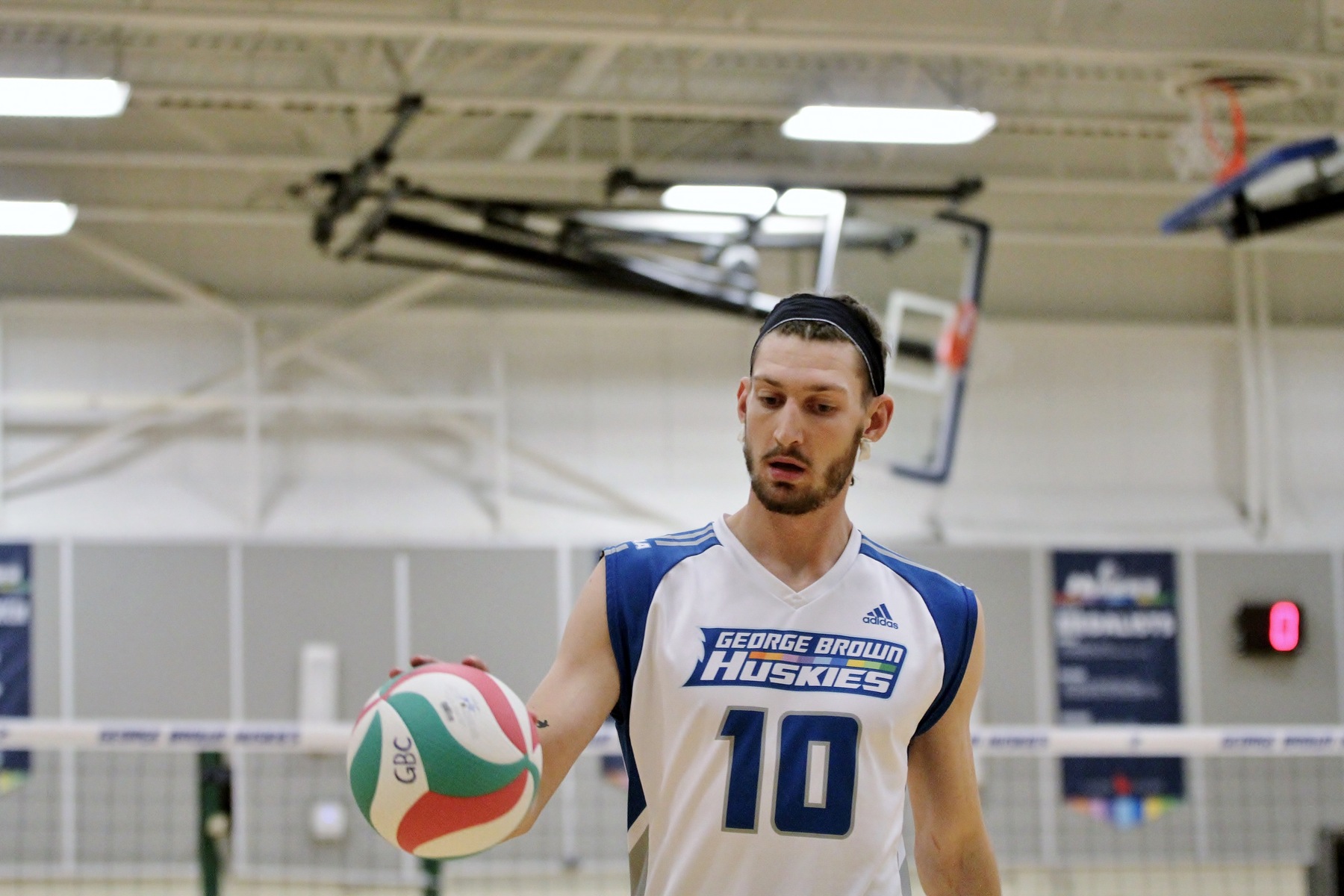 Men's volleyball player with ball in hand