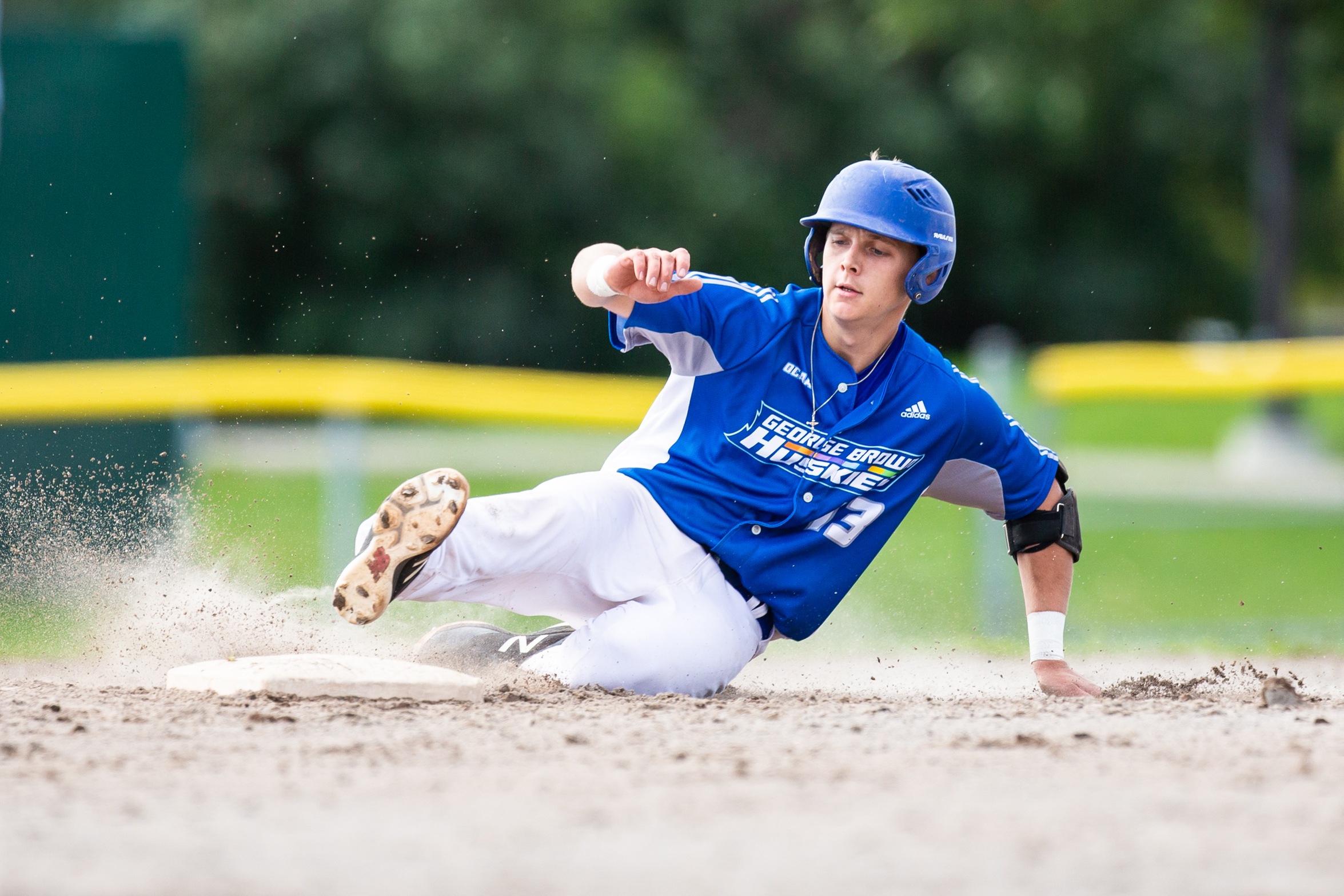 Baseball player slides into base